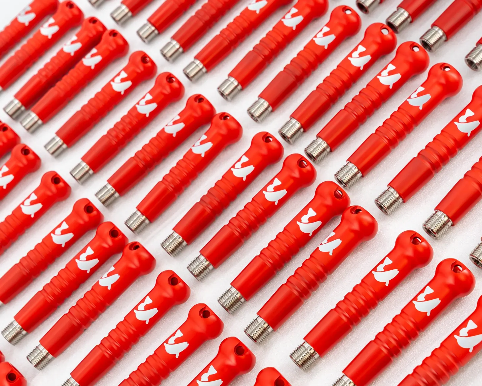 Rows of Toit fish tagging handles in USMC Red with Bright White graphics